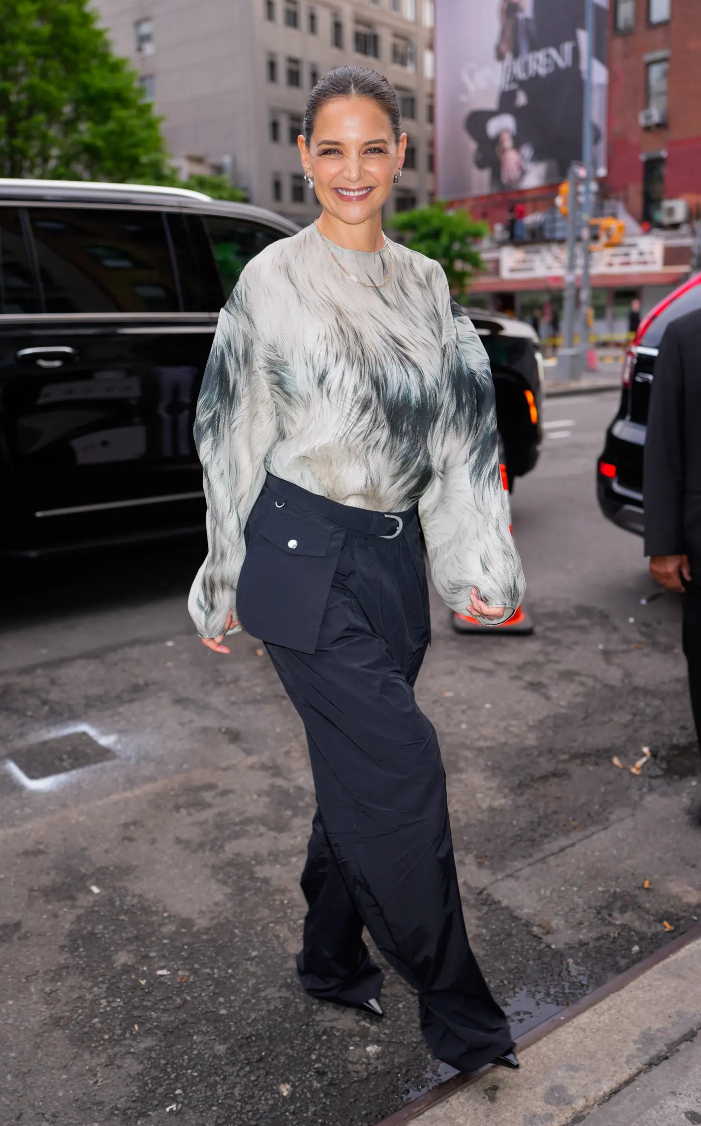 Katie Holmes wears a sheer top and black cargo pants