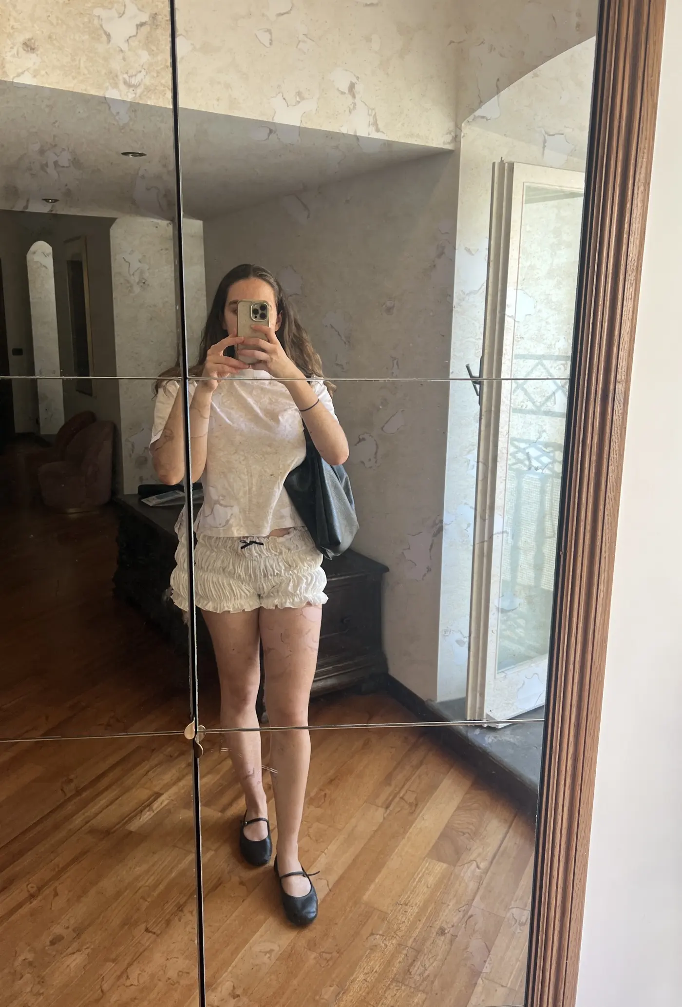 An image of Who What Wear UK SEO Writer Ava Gilchrist wearing a 2025 short trend.