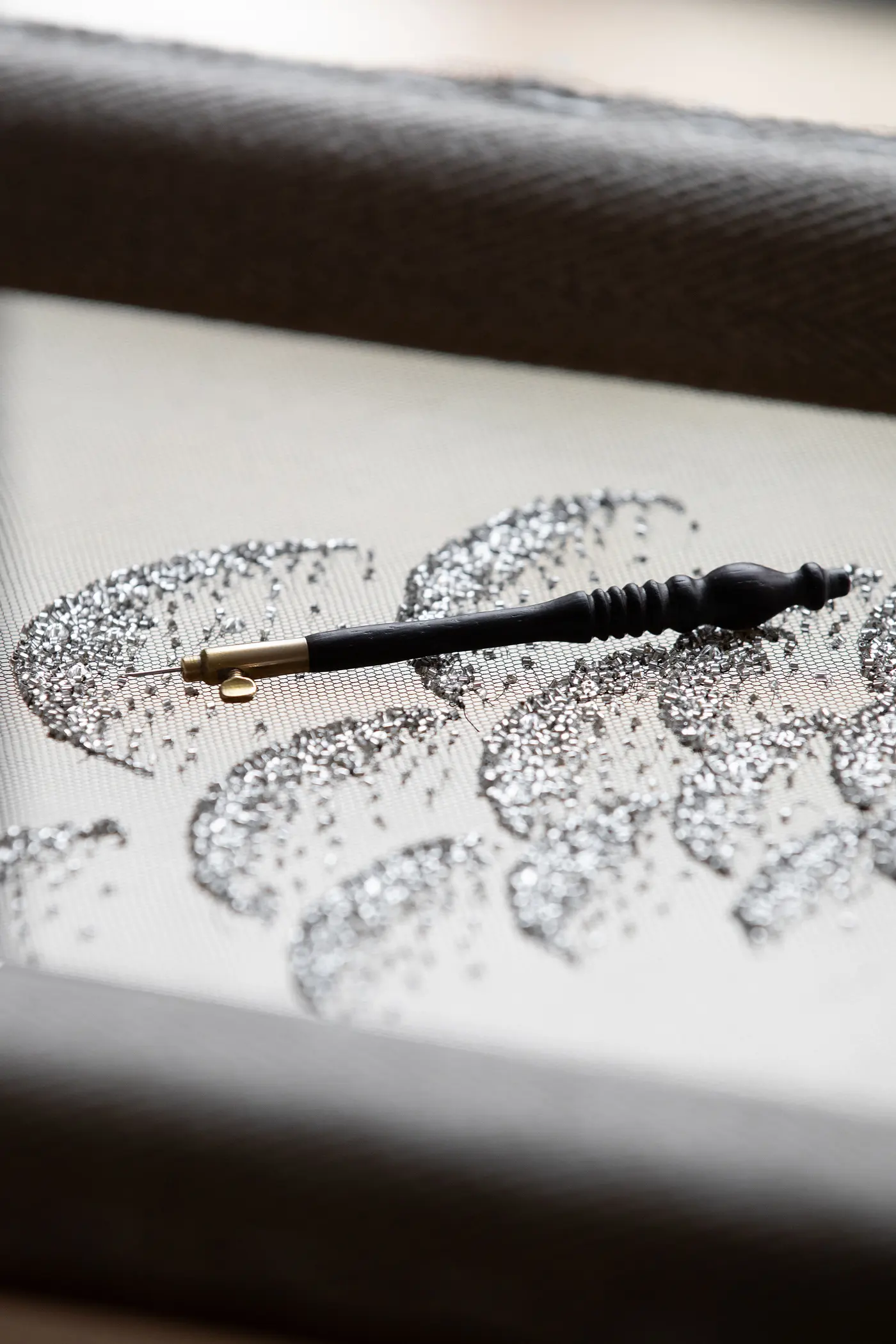 a close up of dior glitter in the dior workshop