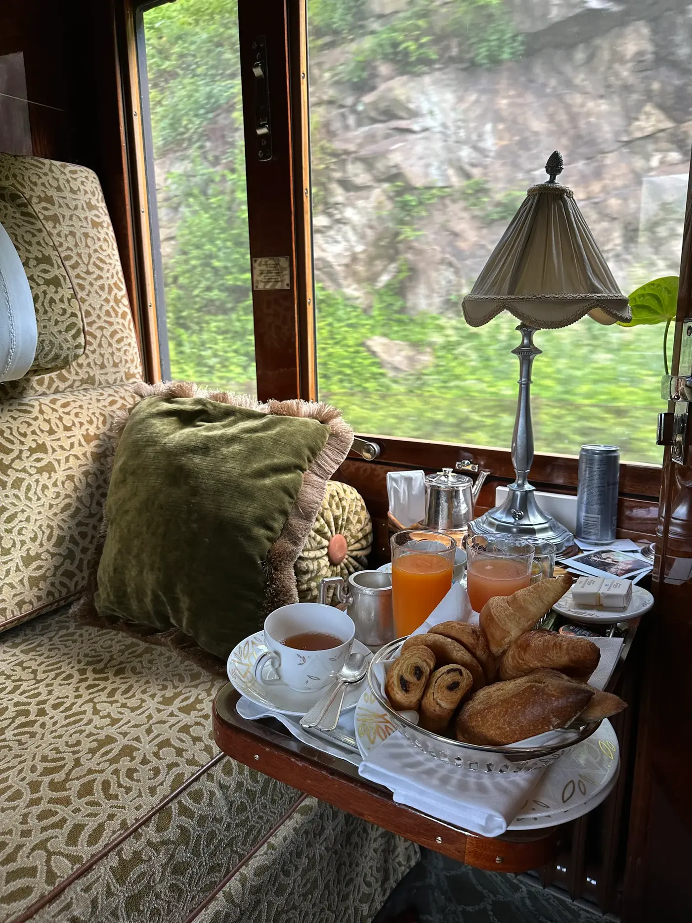 Image may contain Brunch Food Cup Cutlery Spoon Lamp Bread Plate Cushion Home Decor Dining Table and Furniture
