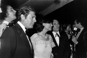 Marcello Mastroianni (2nd from L) and Claudia Cardinale (C) attend the 1976 Cannes Film Festival in Cannes, France, in May 1976.