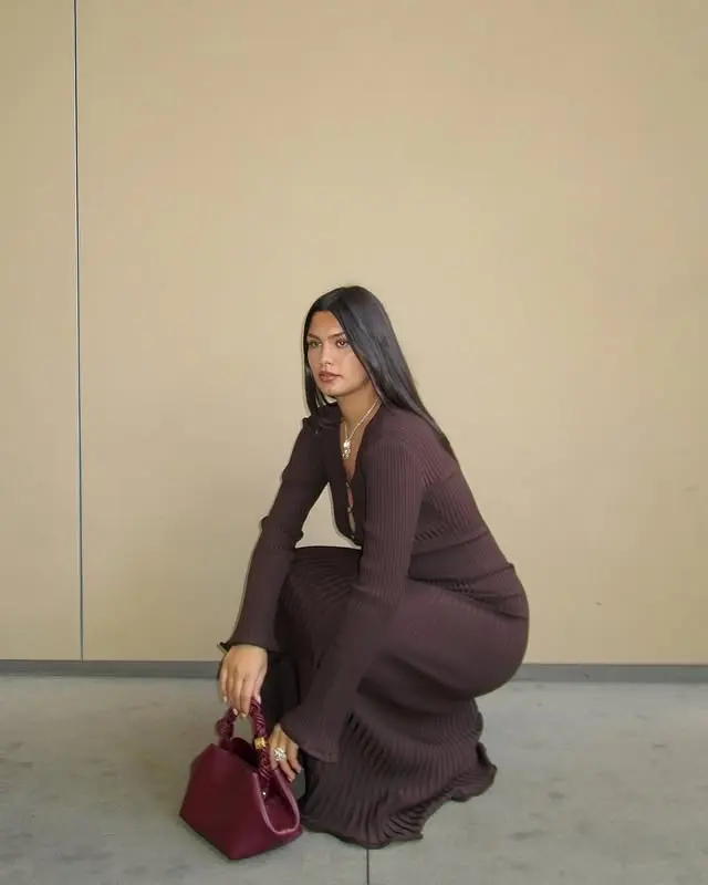 Woman wears brown dress