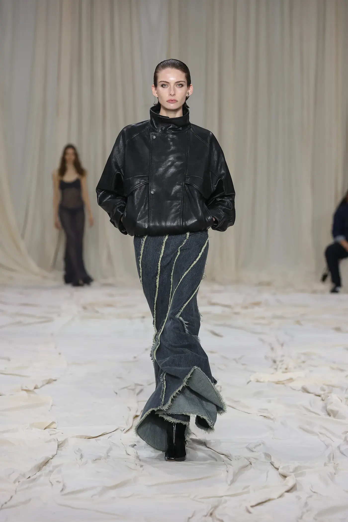 Image may contain Clothing Coat Jacket Adult Person Pants Fashion Footwear and Shoe