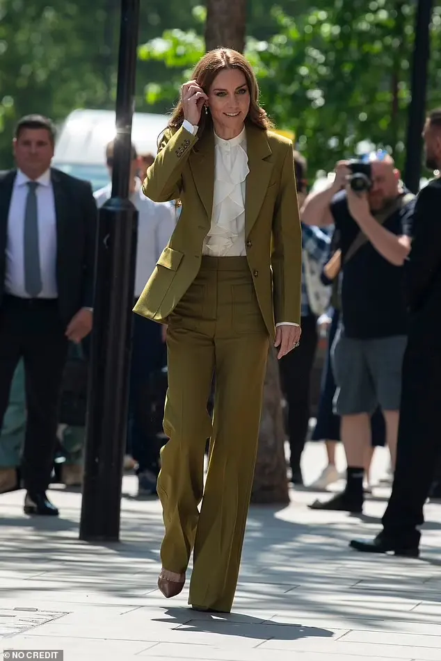 Kate, pictured, was effortlessly elegant in an olive power suit as she made an appearance at the event