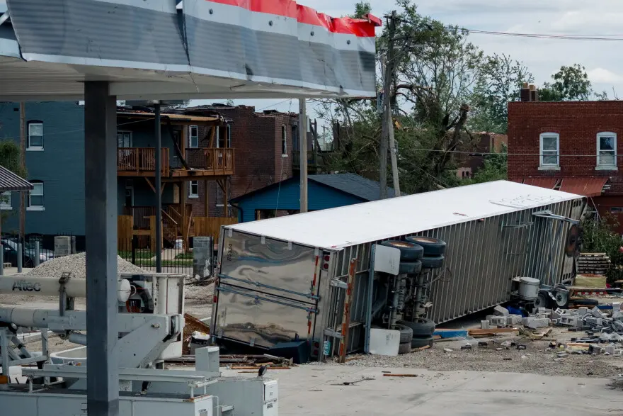 A truck trailer is flipped on its side at the corner of Natural Bridge Avenue and North Newstead Avenue on Saturday, May 17, 2025, after an EF-3 tornado ripped through north St. Louis the day prior.