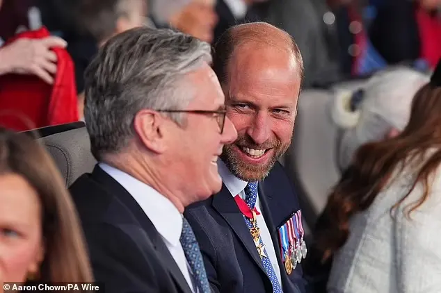 William (pictured) chuckled as he chatted with Sir Keir, the Prime Minister, who he sat next to this evening