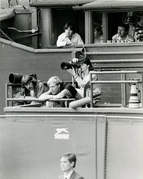 Eileen Langlsey Black and white photo of Eileen shooting at Wimbledon from the photo gantry in 1984.