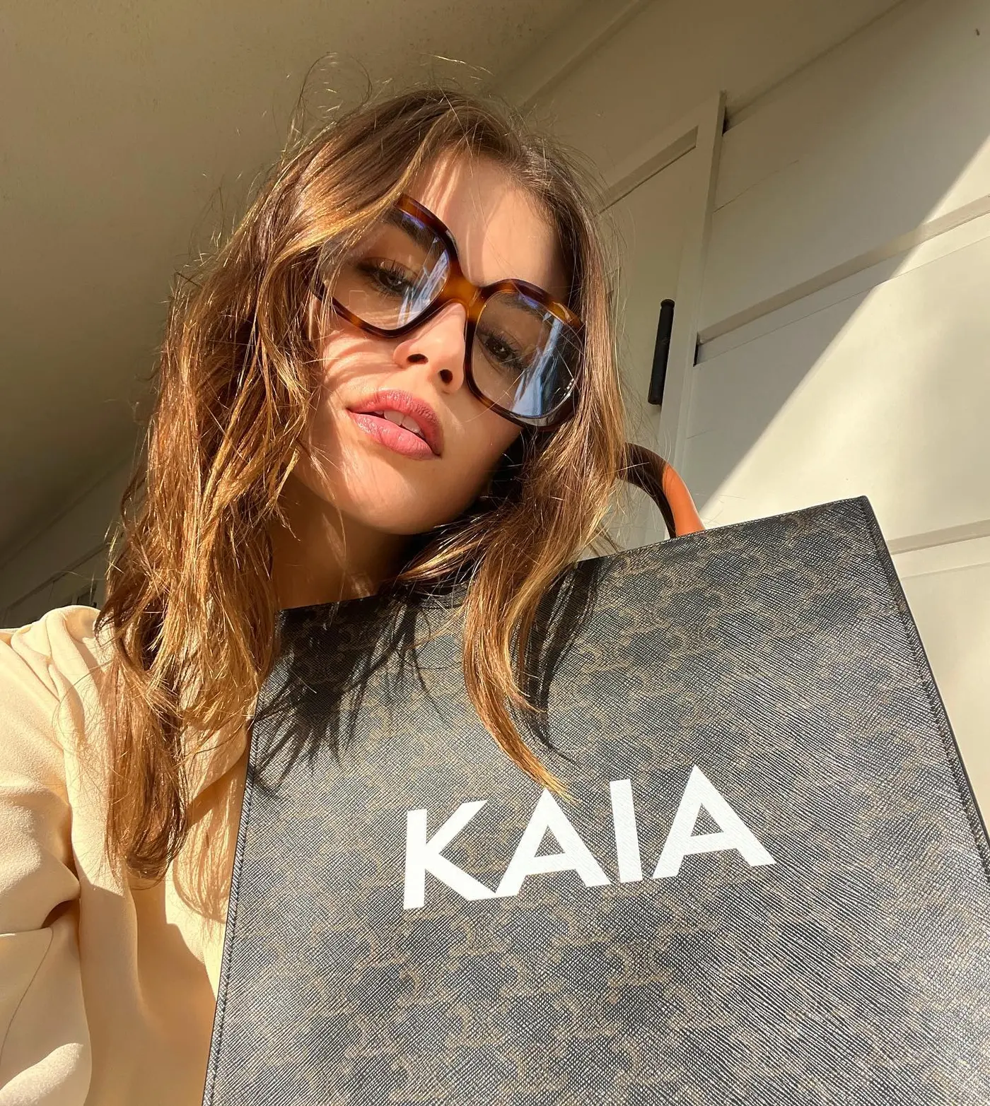An image of @kaiagerber wearing one of the biggest sunglasses trends of 2025.