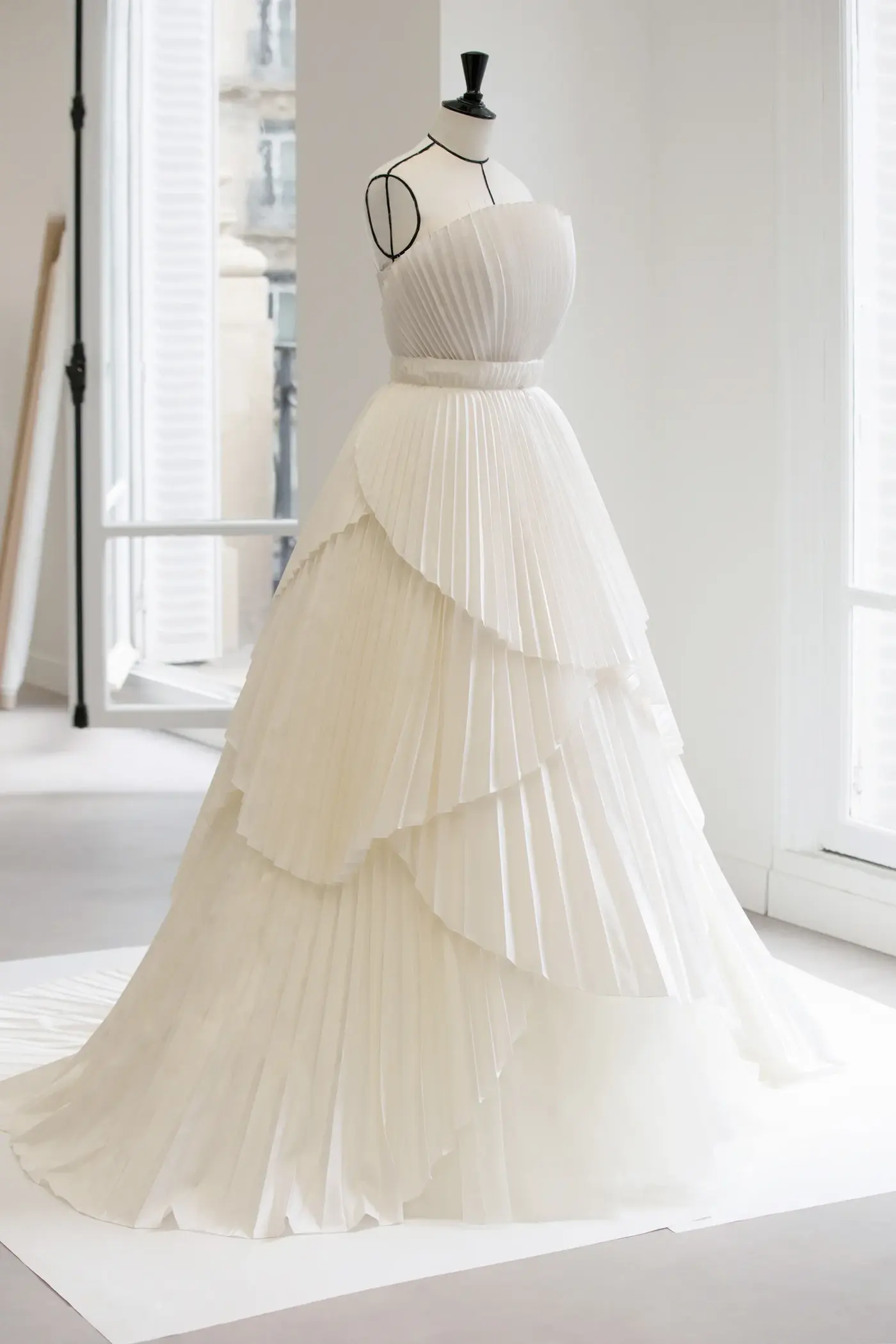 Image may contain Clothing Dress Fashion Formal Wear Gown Wedding and Wedding Gown