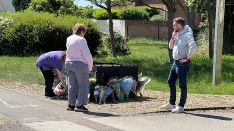 People laying tributes