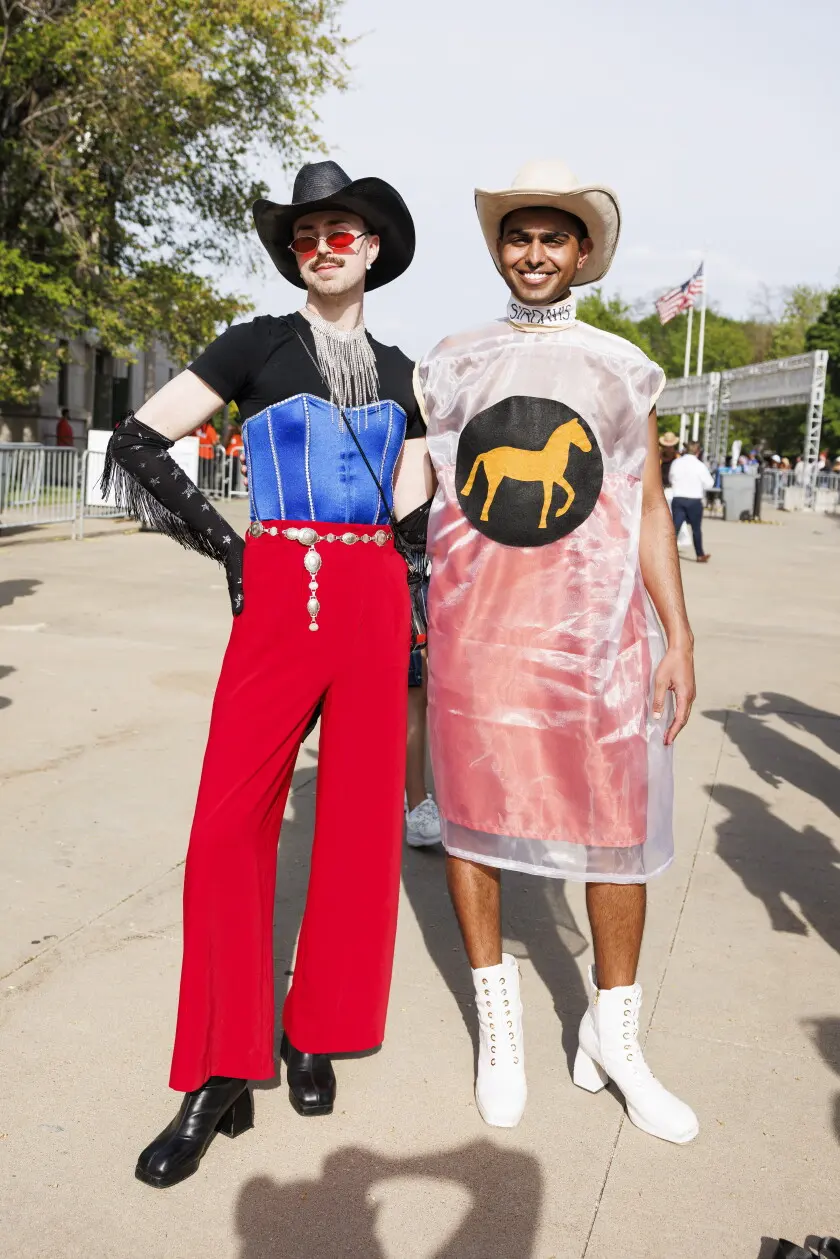 Partners Riley Crosser (left) and Pk Sundar show off their outfit before the Beyonce concert outside Soldier Field, Thursday, May 15, 2025. | Anthony Vazquez/Sun-Times