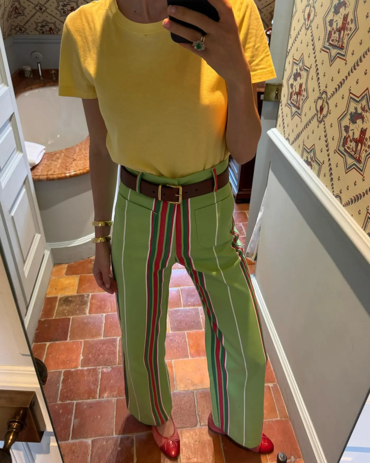 Woman wearing a striped pants outfit.