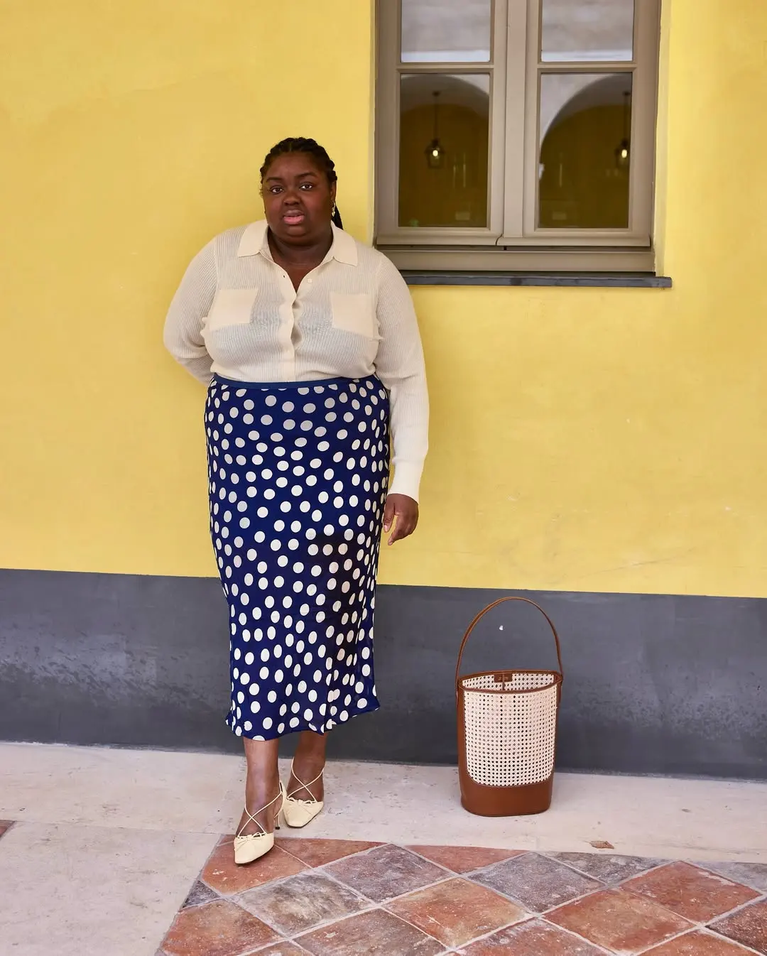 Abi Marvel wears polka dot skirt