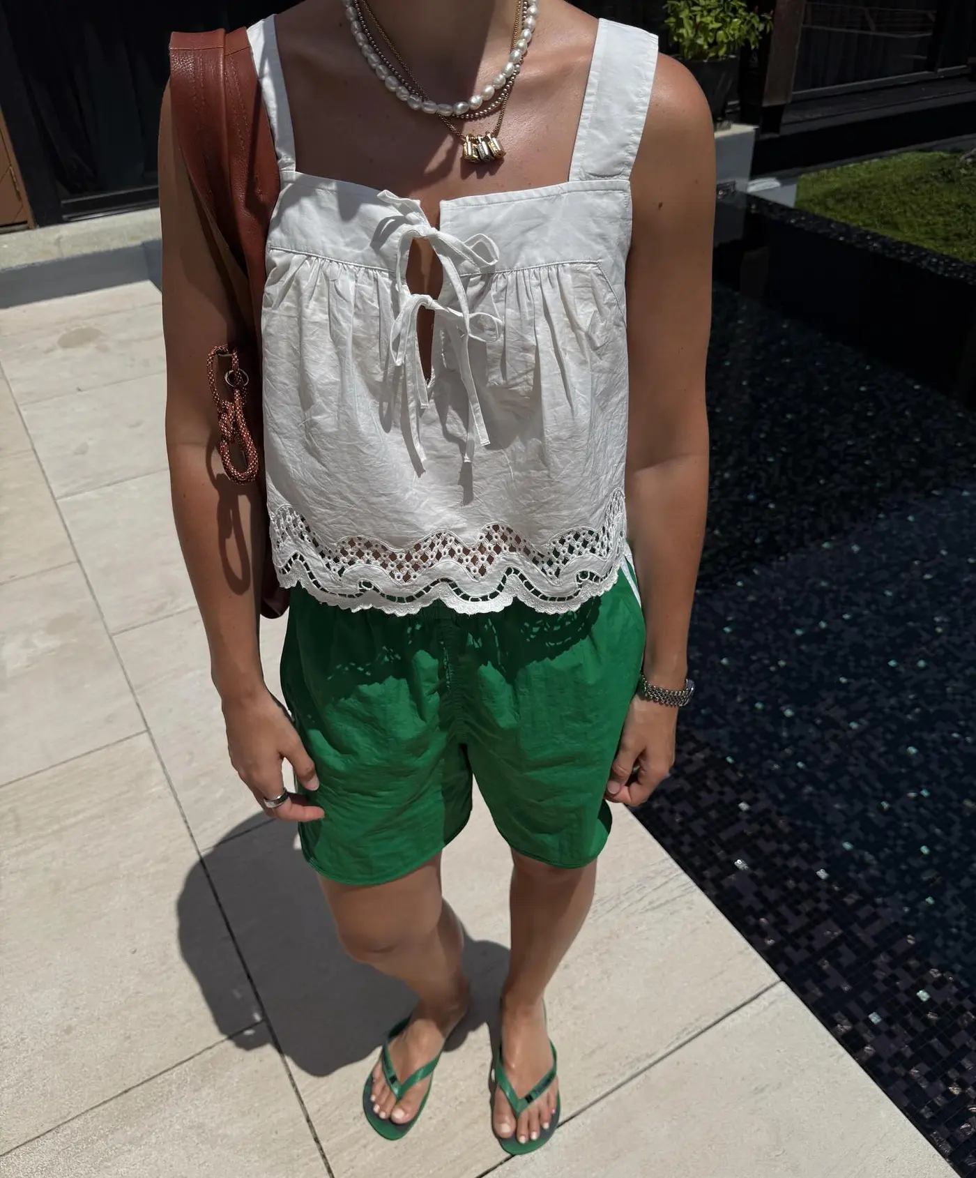 An image of @holliemercedes wearing a 2025 short trend.