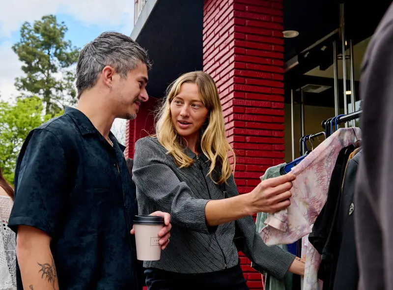 Outfit Repeater L.A. co-founder Francesca Goncalves talks with seller Mitch deQuilettes.