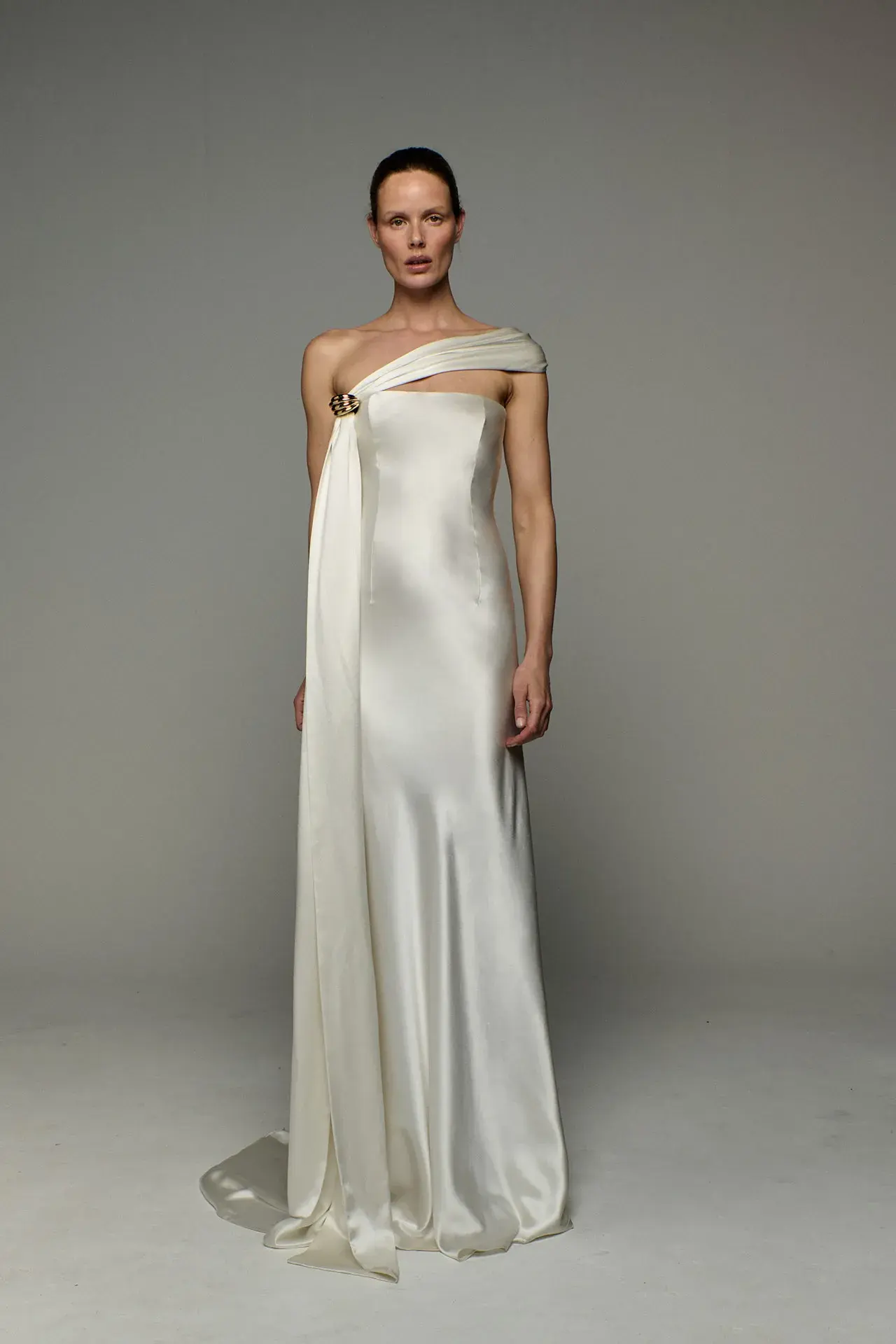Image may contain Clothing Dress Formal Wear Evening Dress Fashion Gown Wedding Wedding Gown Adult Person and Face