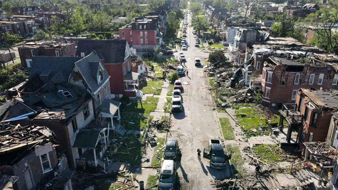 Houses in a neighborhood lie damaged after a tornado struck in St. Louis on