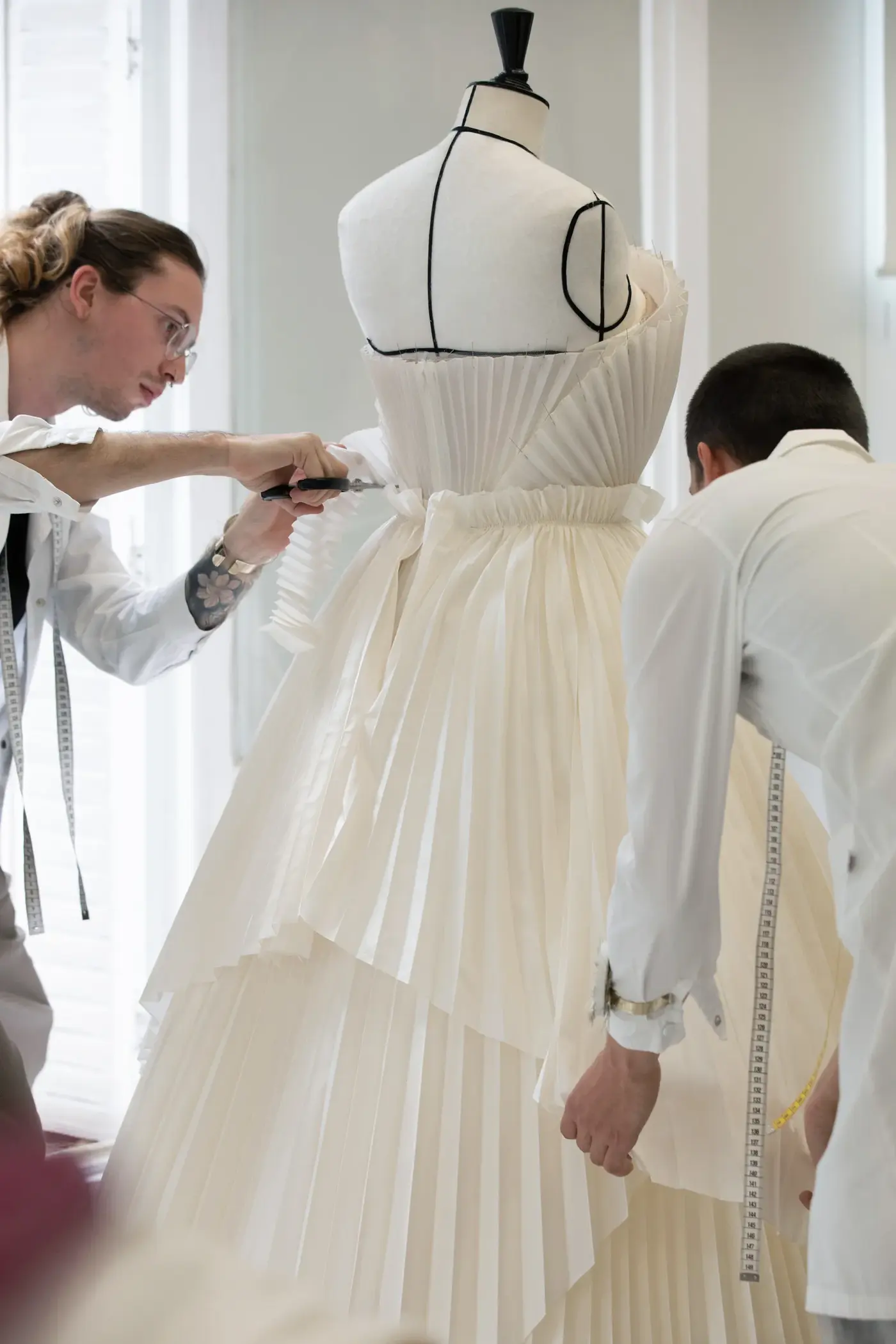 Image may contain Clothing Dress Formal Wear Fashion Gown Wedding Wedding Gown Adult Person and Evening Dress