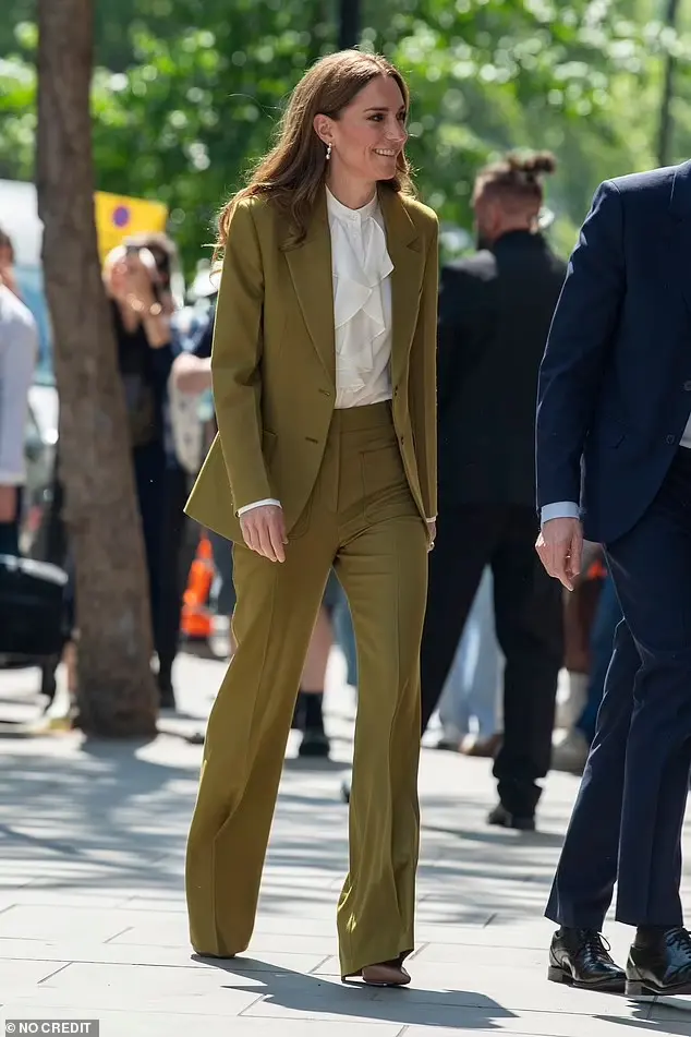 The Princess donned a white blouse, with ruffle detailing, as she was pictured at the event this afternoon