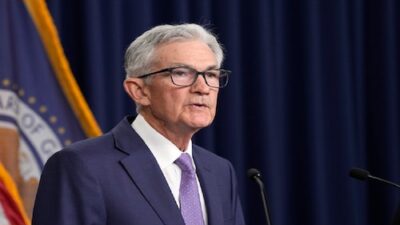 Fed Chair Jerome Powell emphasizes caution regarding interest rate cuts despite pressure from Trump.