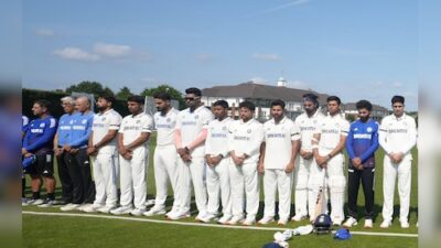 Team India honors Ahmedabad plane crash victims with black armbands and a moment of silence.