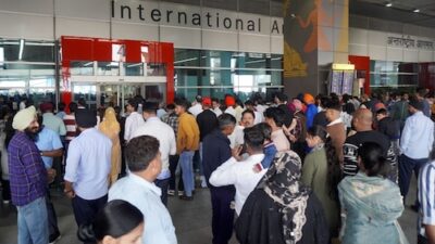 Airport check-in systems encounter problems, leading to flight delays.