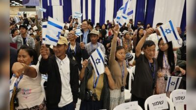 Approximately 240 Indians asserting ancestry from a biblical tribe arrive in Israel through a resettlement initiative.