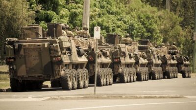 Japan's Prime Minister initiates a committee to reassess national defense strategies amid rising threats.