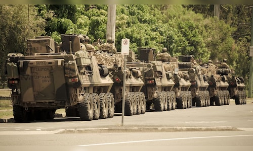 Japan's Prime Minister initiates a committee to reassess national defense strategies amid rising threats.