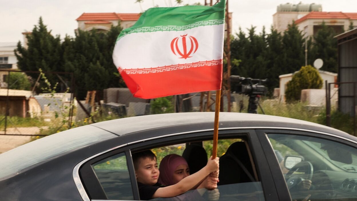 Iranian air defense raises alert in certain areas of Tehran.