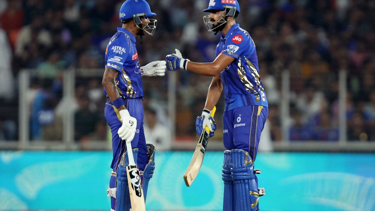 MI choose to field first after winning the toss.