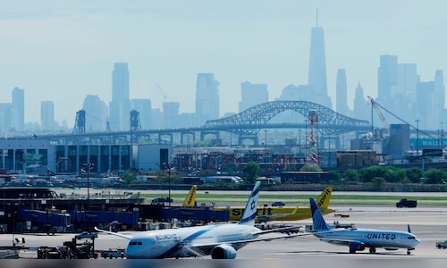United Airlines Flight 169 from Venice collides with a light pole and truck on the New Jersey Turnpike before landing safely at Newark Liberty International Airport.