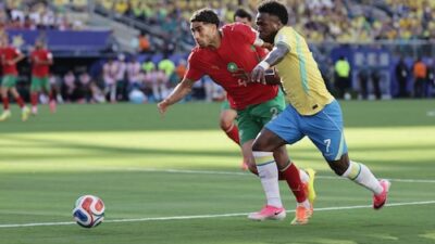 Vinícius Júnior nets stunning goal in Brazil's World Cup opener against Morocco, ending in a draw.